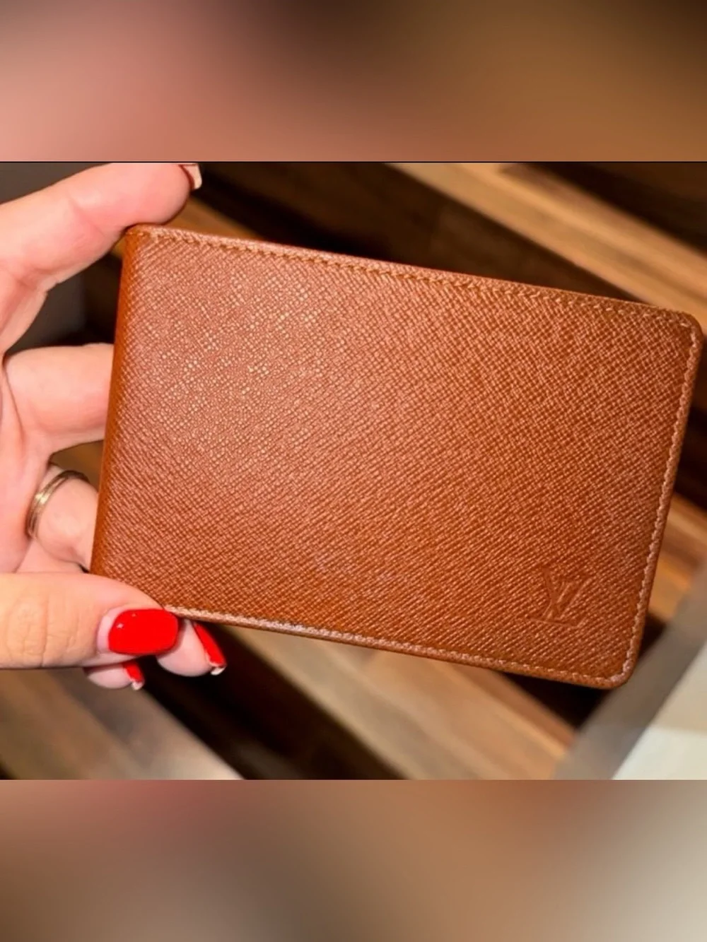 LOUIS VUITTON brown multiple bifold wallet in durable Taiga cross-grain leather